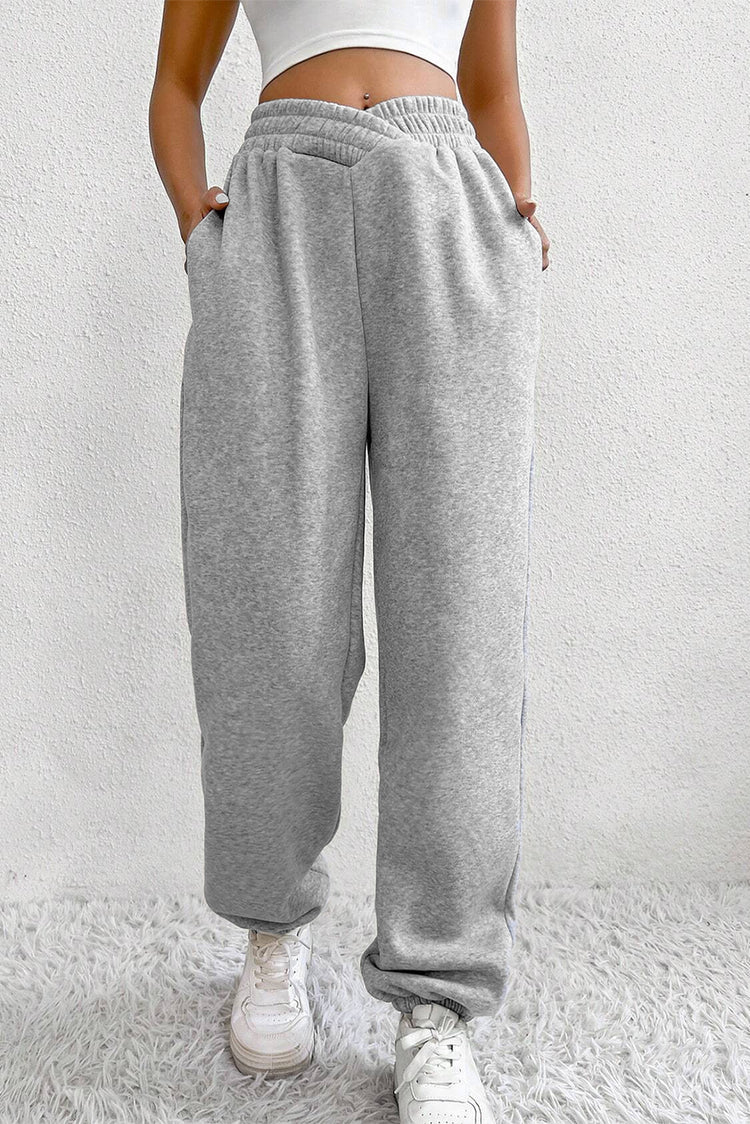 Hellgraue, einfarbige Jogginghose mit gekreuzter Taille - Damesmode