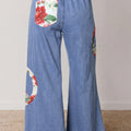 Vaqueros de pierna ancha con parche bordado con el símbolo floral de la paz de Myosotis - Foto 2