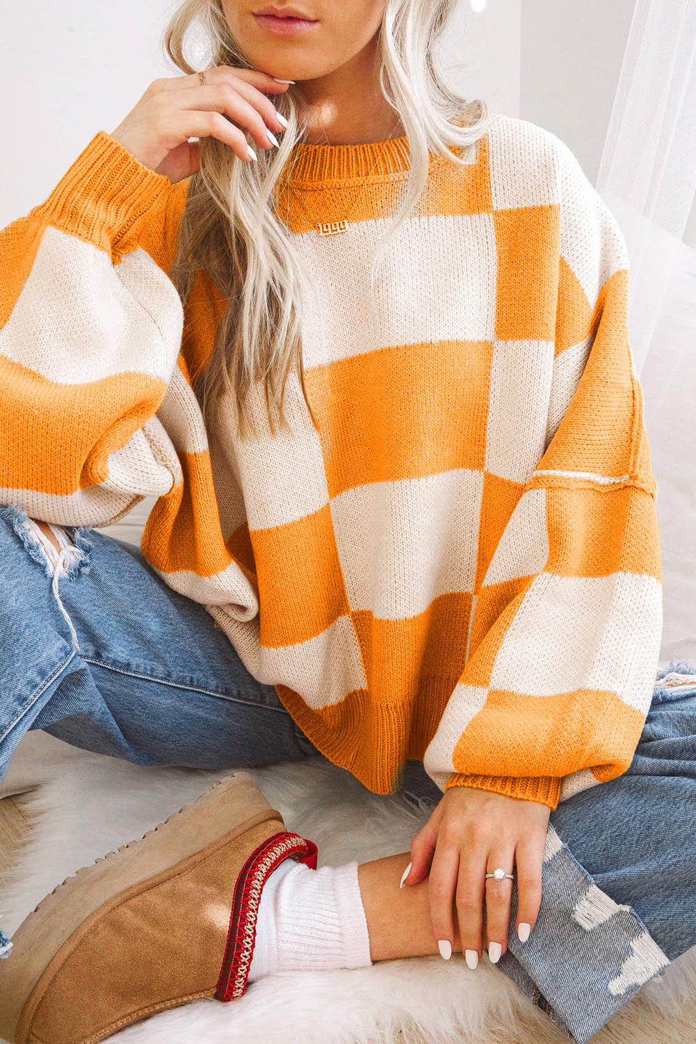 Pull à manches en damier rose à manches en évêque