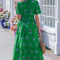 Grünes Maxikleid mit gespaltenem Schnitt mit geschnittenem Schnitt und Rüschensaum - Foto 2