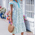 Vestido largo de manga relleno de manga relleno estampada de girasol azul cielo con ribetes de rayas y parches - Foto 3