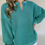 Sudadera Skobeloff de color sólido con escote muescado y hombros bajos