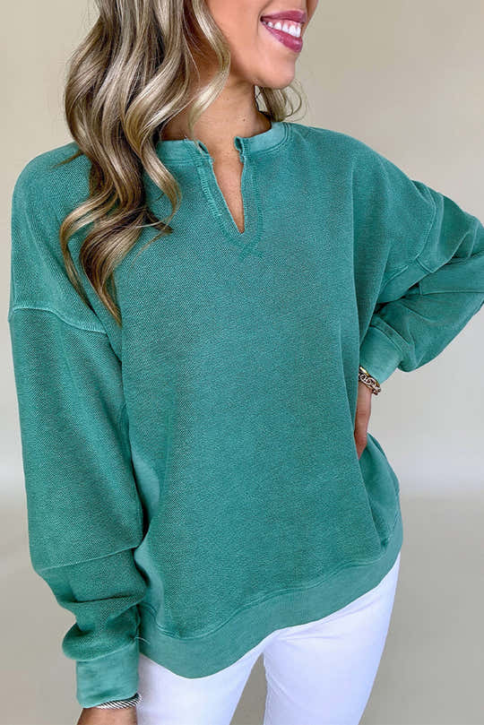 Sudadera Skobeloff de color sólido con escote muescado y hombros bajos