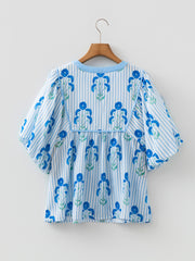 Himmelblå bluse med blomsterprint med slipshals og puffærmer - Miniatuur