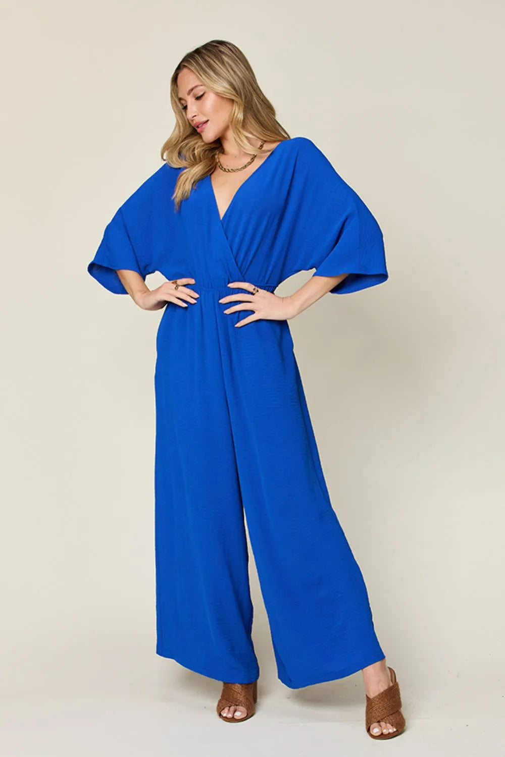 Double Take Full Size Surplice Wide Leg Jumpsuit with Pockets - Luxe Damesmode & Kleding Collectie | Redblad Nederland
