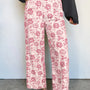 Pantalon en jean en denim rose à motif floral vintage