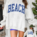 Hellgrauer Pullover mit Mock-Neck-Grafikdruck, drehbarer Pullover - Foto 1