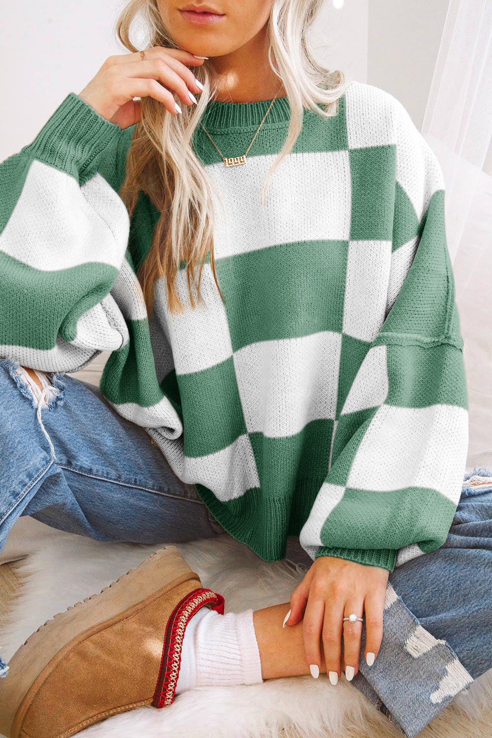 Pull à manches en damier rose à manches en évêque