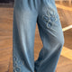 Beau Blauw ausgefranster Gebloemde-Patch mit weitem Bein, roher Saum, weite Jeans