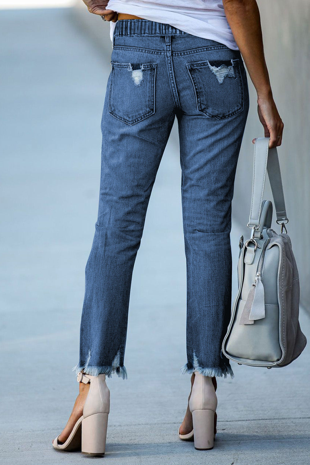 Dunkelblaue elastische Taille, gerade Beine zerstörte Rohsaum-Jeans