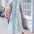 Vestido largo de manga relleno de manga relleno estampada de girasol azul cielo con ribetes de rayas y parches - Foto 2