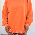 Sudadera oversized con acabado contrastante de lunares naranja - Foto 1