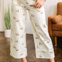 Vaqueros beige estilosos con estampado de ánade real con puños y bajo shift