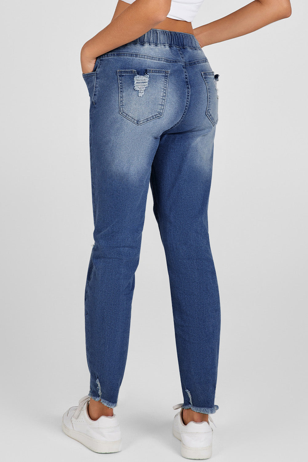 Dunkelblaue elastische Taille, gerade Beine zerstörte Rohsaum-Jeans